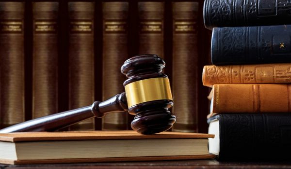 judge-gavel-on-a-book-law-books-background-wooden-desk-e1622361337922.jpg
