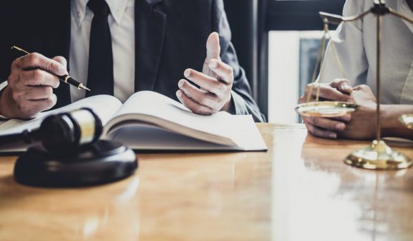male-lawyer-or-counselor-working-in-courtroom-have-meeting-with-client-are-consultation-with-e1622361295697.jpg